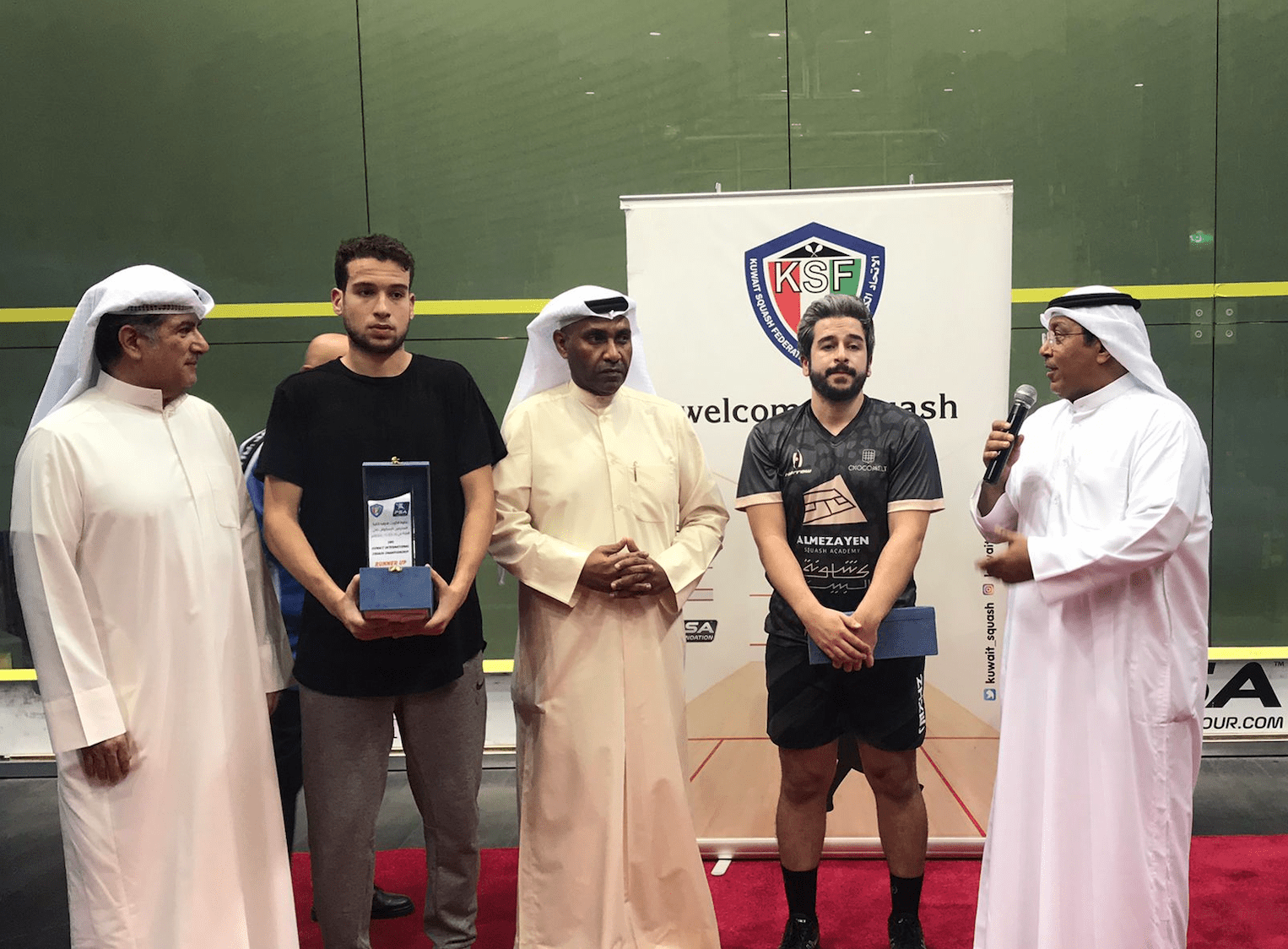 Abdullah Almezayen (second right) at the prizegiving ceremony in Hawally