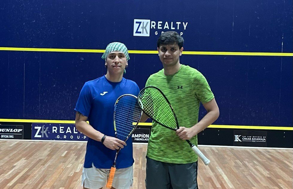 Muhammad Asim Khan (right) and Andres Herrera (left) on court in Houston