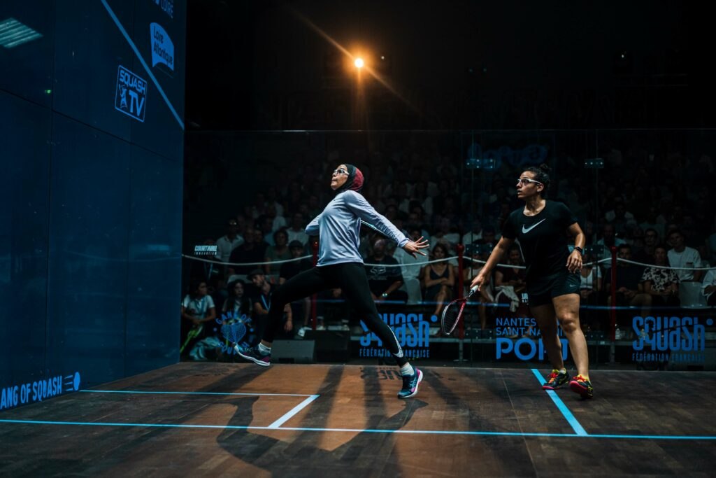 Salma Eltayeb (left) and Kenzy Ayman (right) in action at the Open de France de Squash