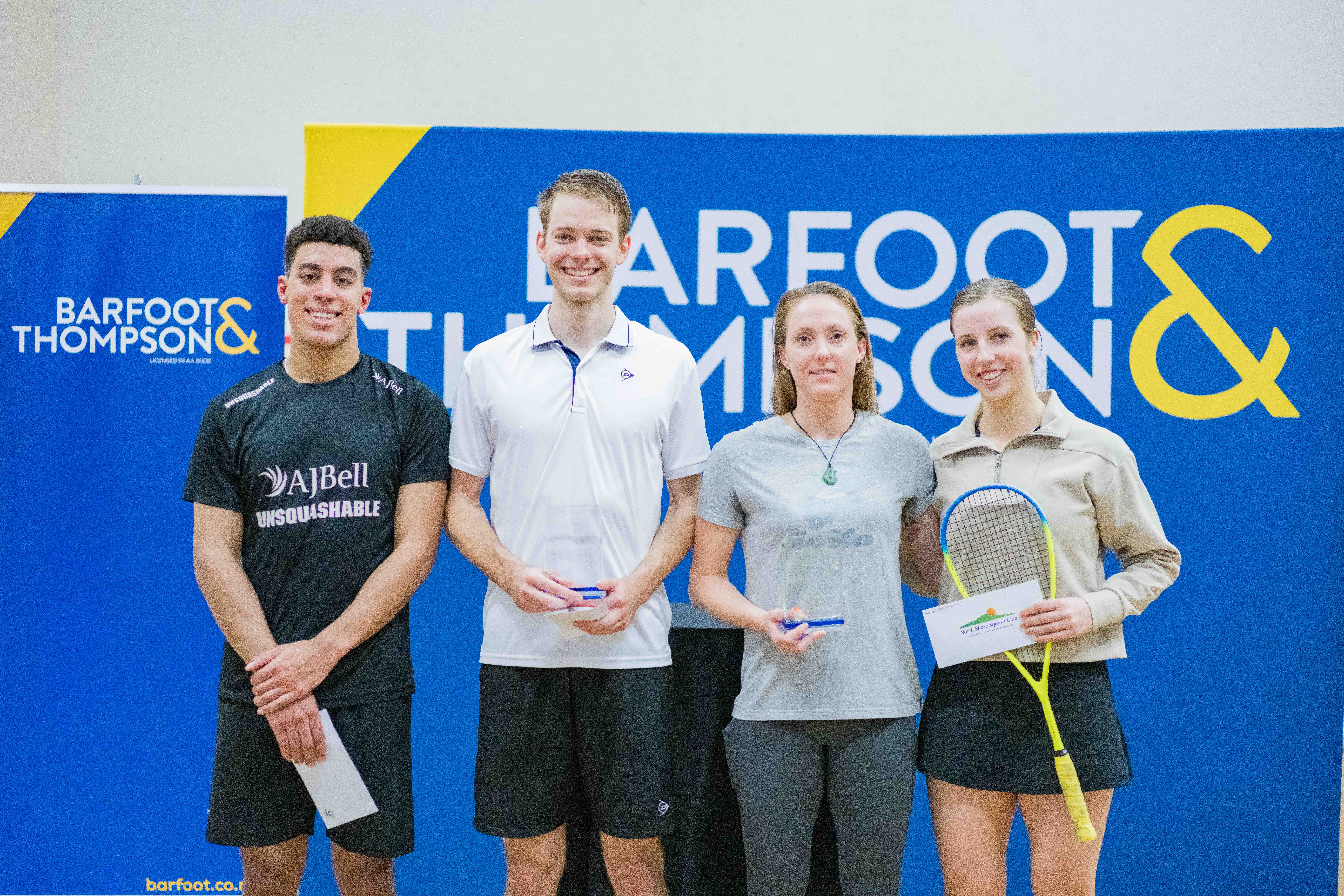 Joseph White (centre left) and Lana Harrison (centre right) with the Barfoot & Thompson Auckland/Oceania Open trophies